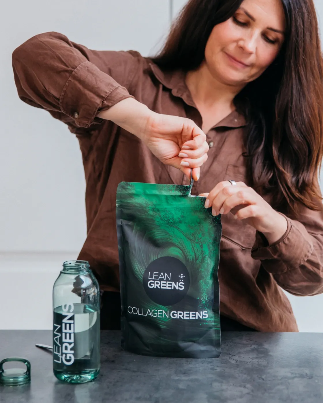Woman adding Collagen Greens to her routine